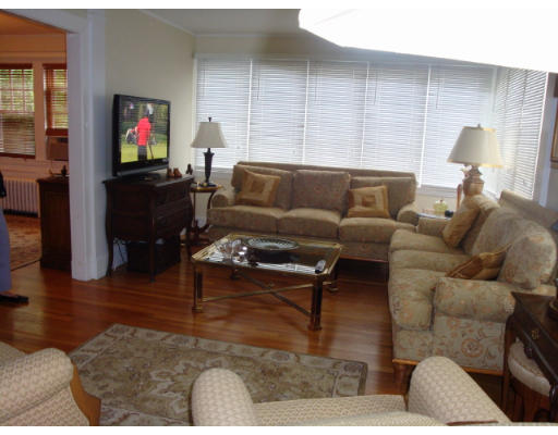 81 Robbins Road Watertown, MA 02472 - Photo 11 of 11 a living room with furniture wooden floor and a flat screen tv