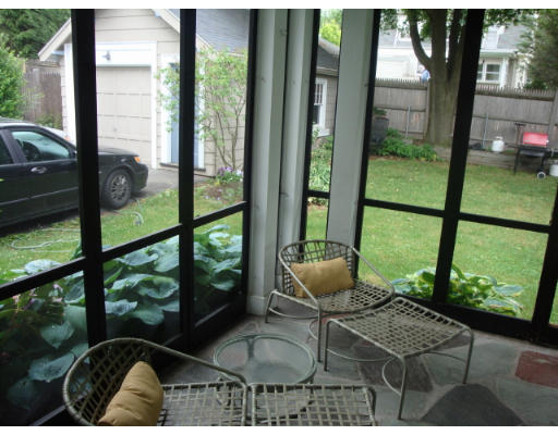 81 Robbins Road Watertown, MA 02472 - Photo 4 of 11 a living room filled with furniture and a floor to ceiling window