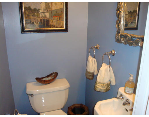 81 Robbins Road Watertown, MA 02472 - Photo 7 of 11 a bathroom with a toilet and a mirror