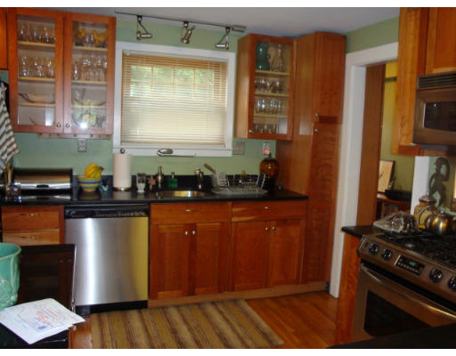 81 Robbins Road Watertown, MA 02472 - Photo 8 of 11 a kitchen with stainless steel appliances granite countertop a stove and a refrigerator