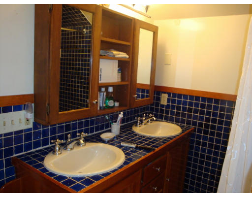 81 Robbins Road Watertown, MA 02472 - Photo 9 of 11 a bathroom with a sink and a mirror