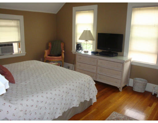 81 Robbins Road Watertown, MA 02472 - Photo 10 of 11 a bedroom with a bed and a flat screen tv