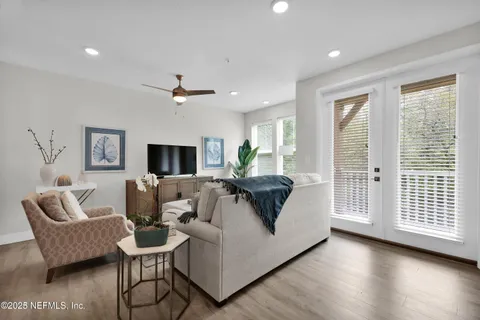 a living room with furniture and a large window