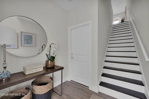 a view of entryway with wooden floor