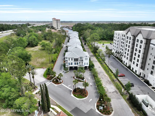 an aerial view of a house with outdoor space