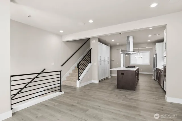 a view of kitchen with furniture and wooden floor