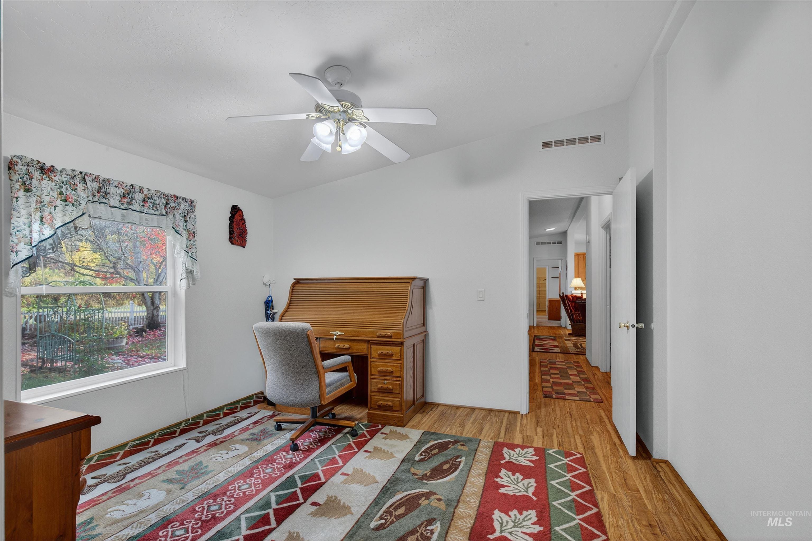 4151 Highway 13 Stites, ID 83552 - Photo 19 of 50 Home office with light wood-type flooring and a ceiling fan