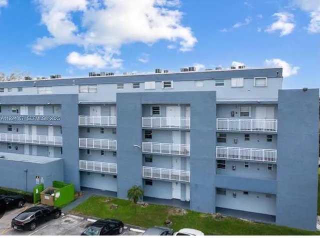 a view of a building with a garden