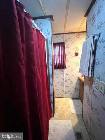 a bathroom with a shower and toilet