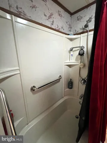 a bathroom with a sink vanity and mirror