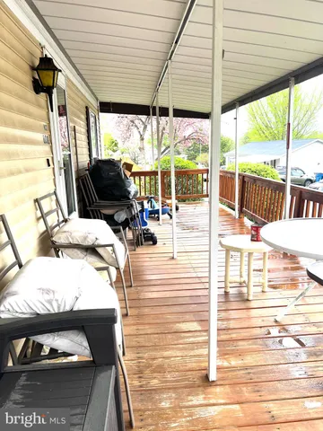 a view of living room with furniture and floor to ceiling window