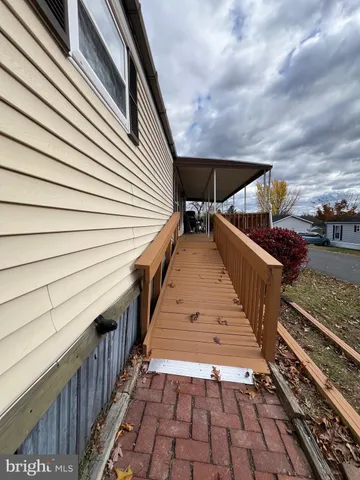 a view of outdoor space with deck and wooden floor