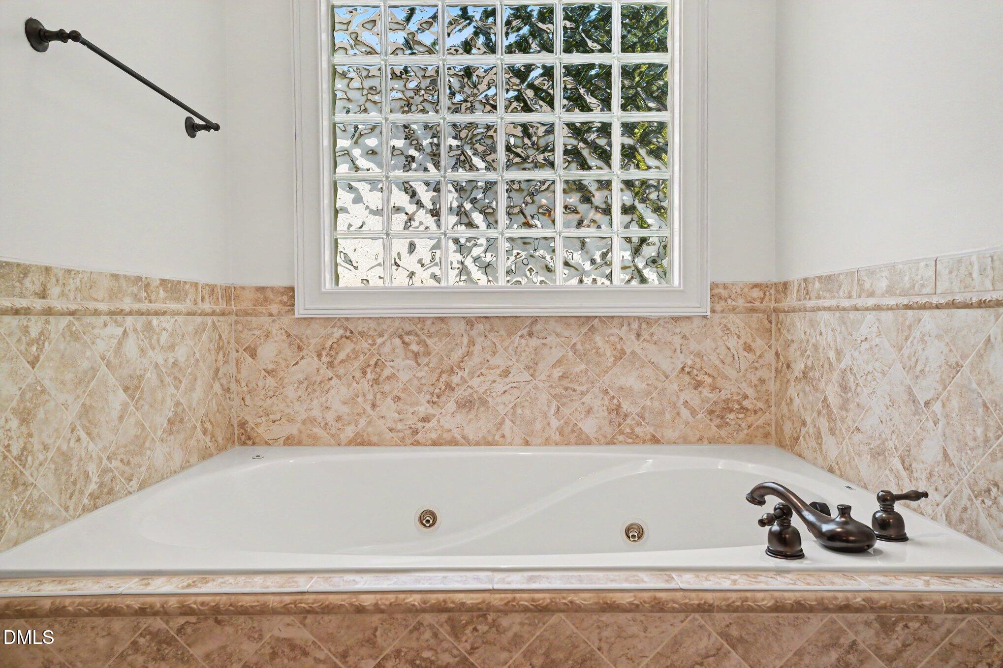 1729 Frenchwood Drive Raleigh, NC 27612 - Photo 16 of 46 a bathroom with a bathtub and shower