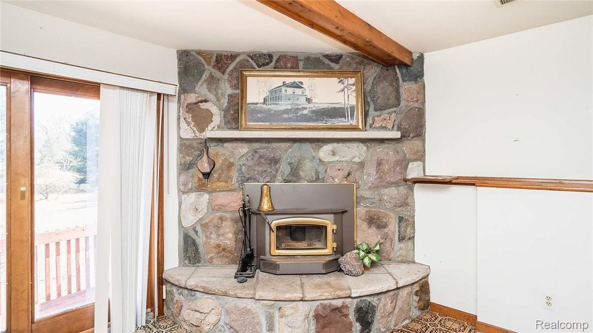 3201 Jewell Road Howell, MI 48843 - Photo 40 of 46 HANDSOME NATURAL FIREPLACE IN LOWER LEVEL