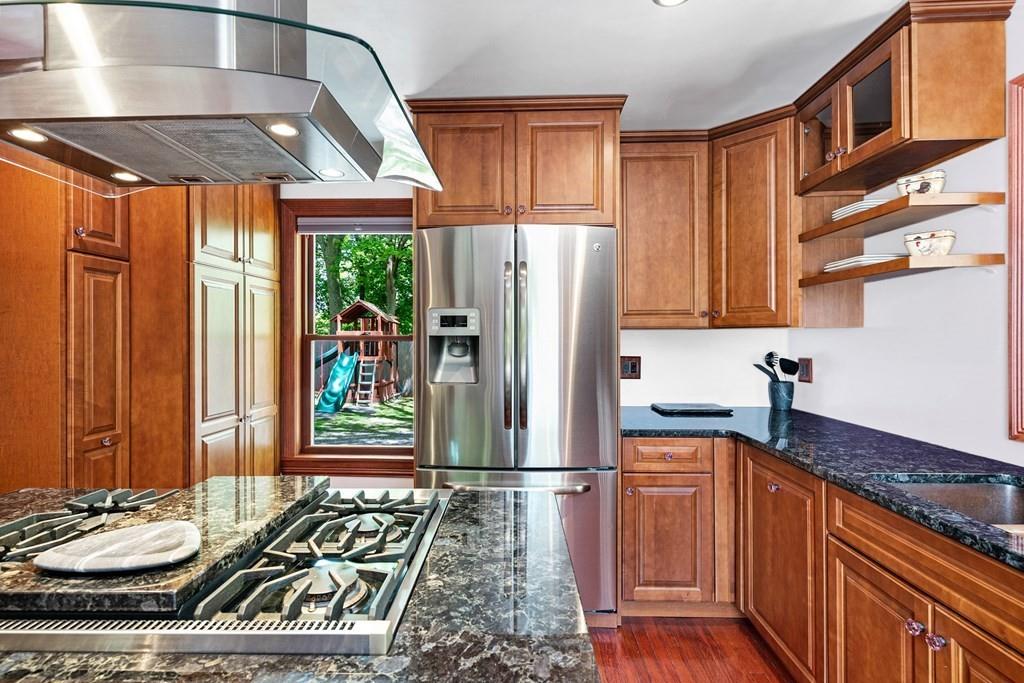 46 River Ridge Wellesley, MA 02481 - Photo 11 of 27 a kitchen with stainless steel appliances granite countertop a refrigerator and a stove