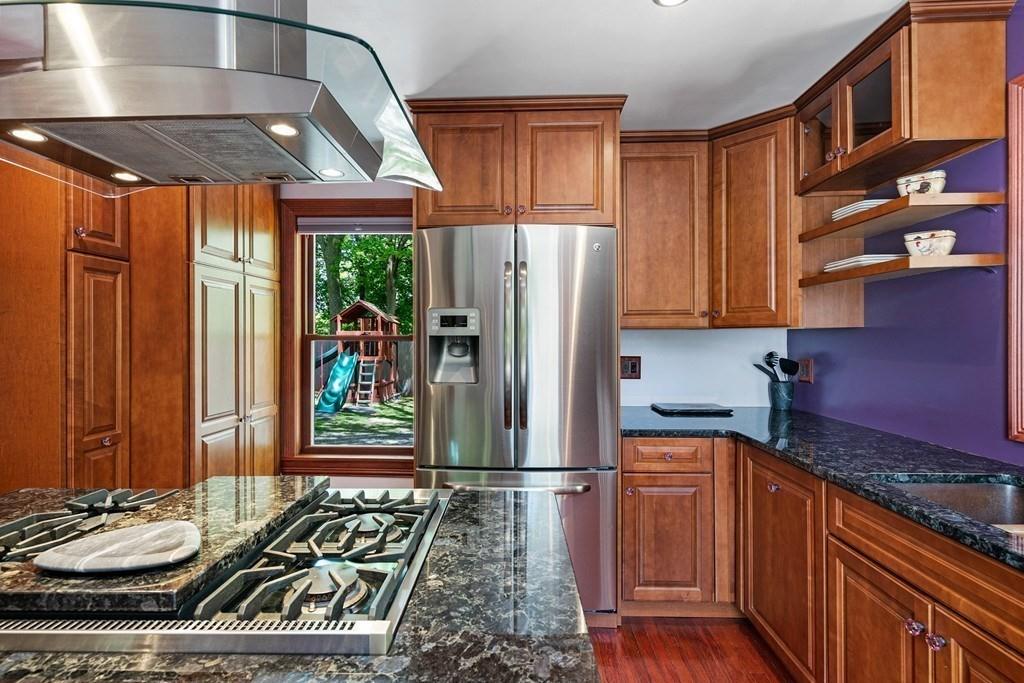 46 River Ridge Wellesley, MA 02481 - Photo 12 of 27 a kitchen with stainless steel appliances granite countertop a refrigerator and a stove