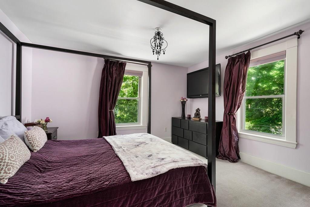 46 River Ridge Wellesley, MA 02481 - Photo 14 of 27 a bedroom with a bed dresser and a large window
