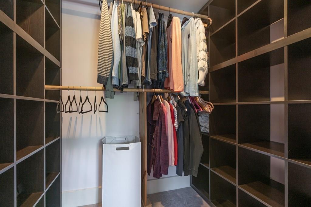 46 River Ridge Wellesley, MA 02481 - Photo 15 of 27 a view of walk in closet with clothes and shoes