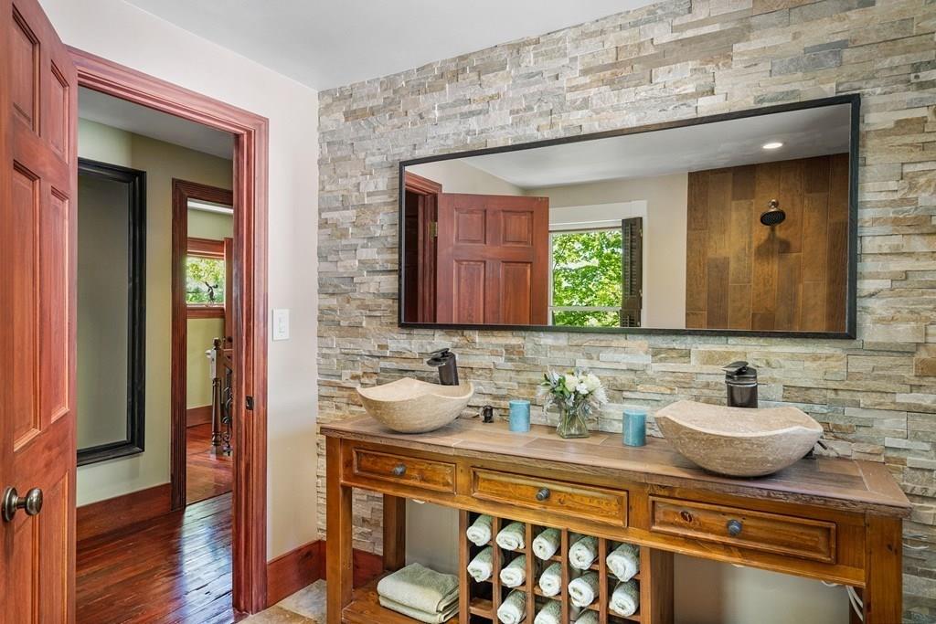 46 River Ridge Wellesley, MA 02481 - Photo 16 of 27 a bathroom with a sink and a mirror