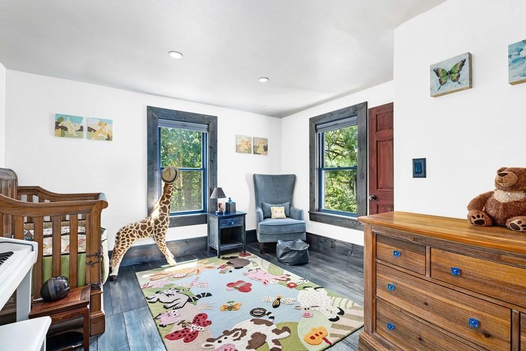 46 River Ridge Wellesley, MA 02481 - Photo 18 of 27 a bedroom with a bed and wooden floor
