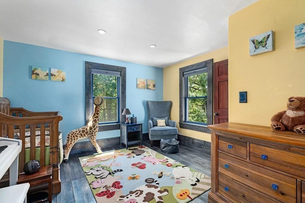 46 River Ridge Wellesley, MA 02481 - Photo 19 of 27 a bedroom with a bed and wooden floor