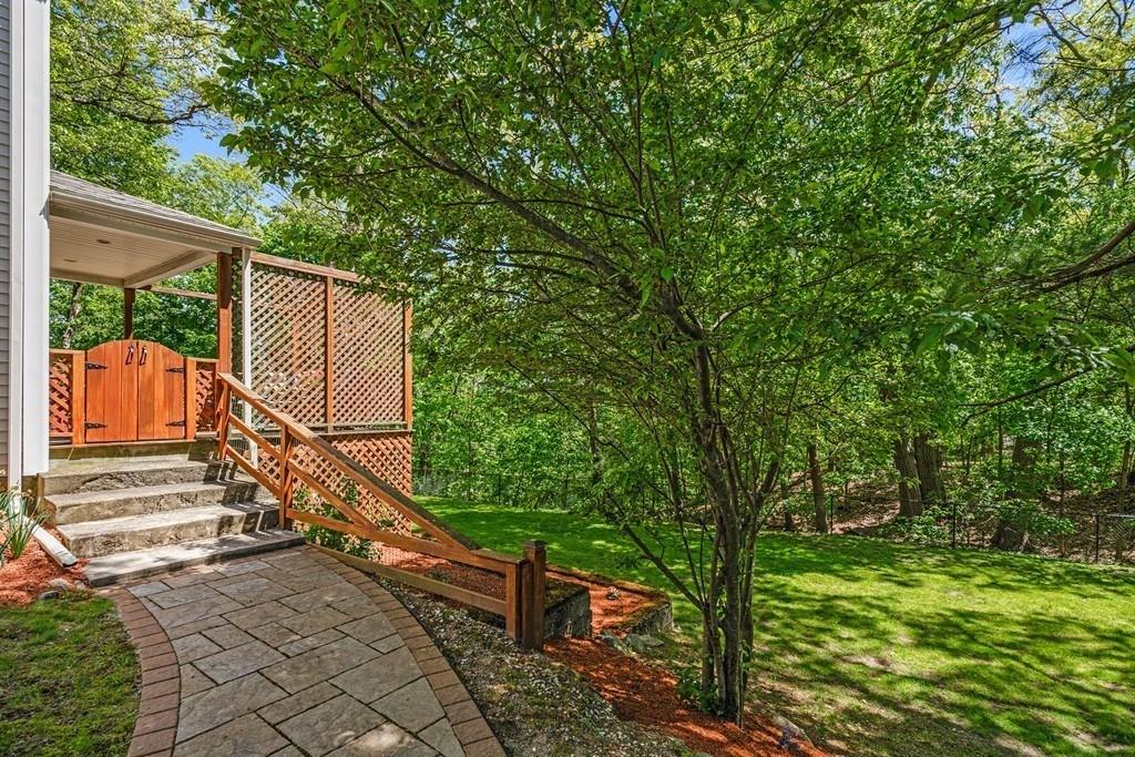46 River Ridge Wellesley, MA 02481 - Photo 20 of 27 a view of a wooden deck with a trees