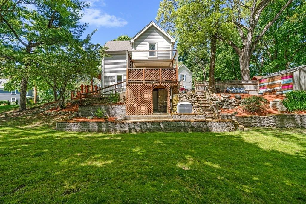 46 River Ridge Wellesley, MA 02481 - Photo 22 of 27 a view of house with backyard and garden