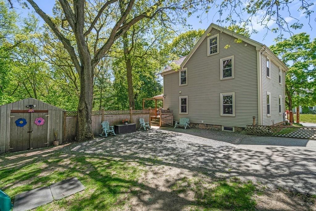 46 River Ridge Wellesley, MA 02481 - Photo 25 of 27 a backyard of a house with shaded area