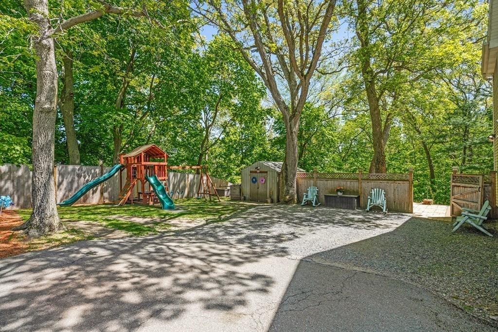 46 River Ridge Wellesley, MA 02481 - Photo 26 of 27 a view of backyard with table and chairs