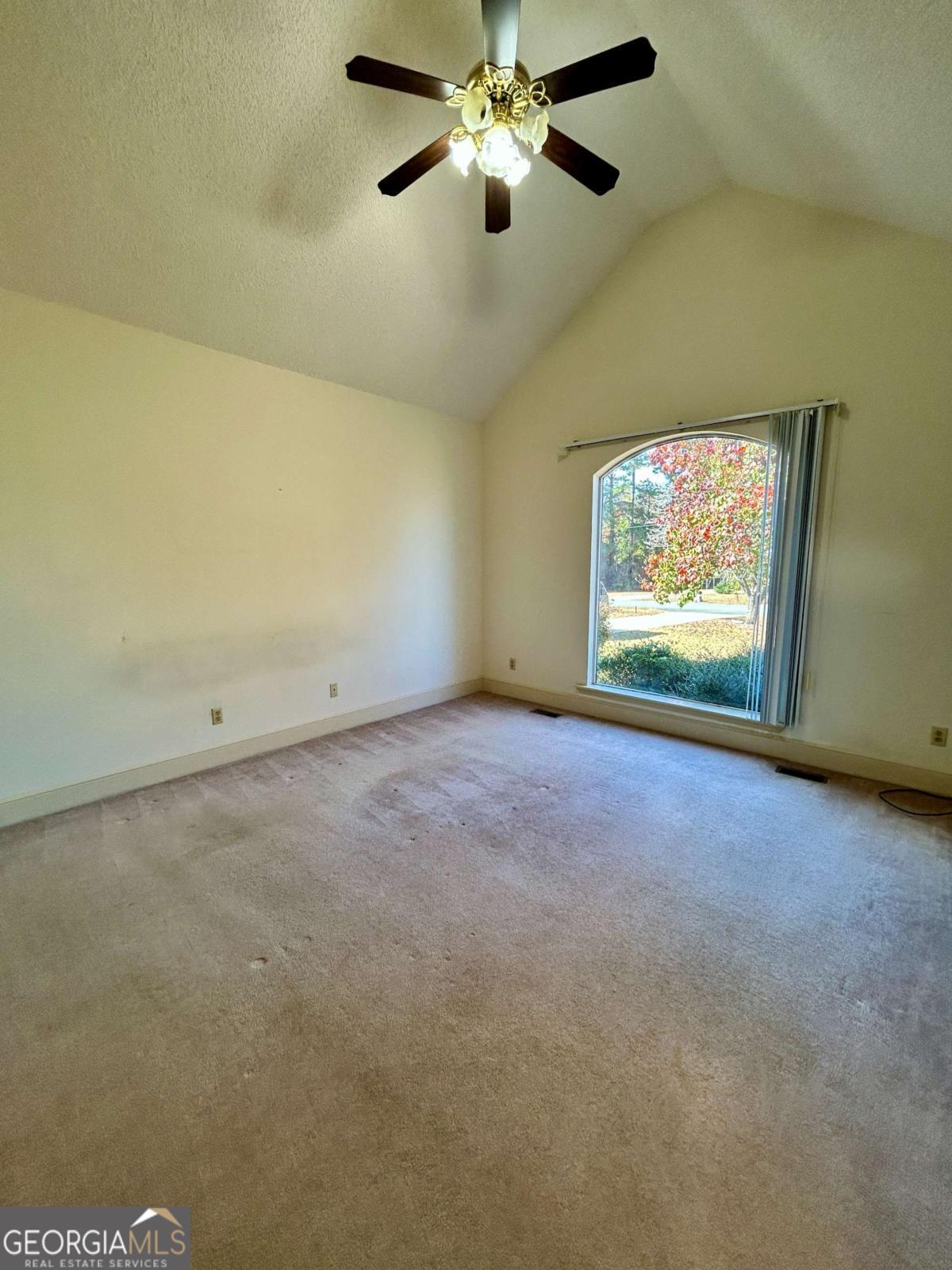 39 Paradise Lake Road Tifton, GA 31794 - Photo 11 of 23 an empty room with windows and fan