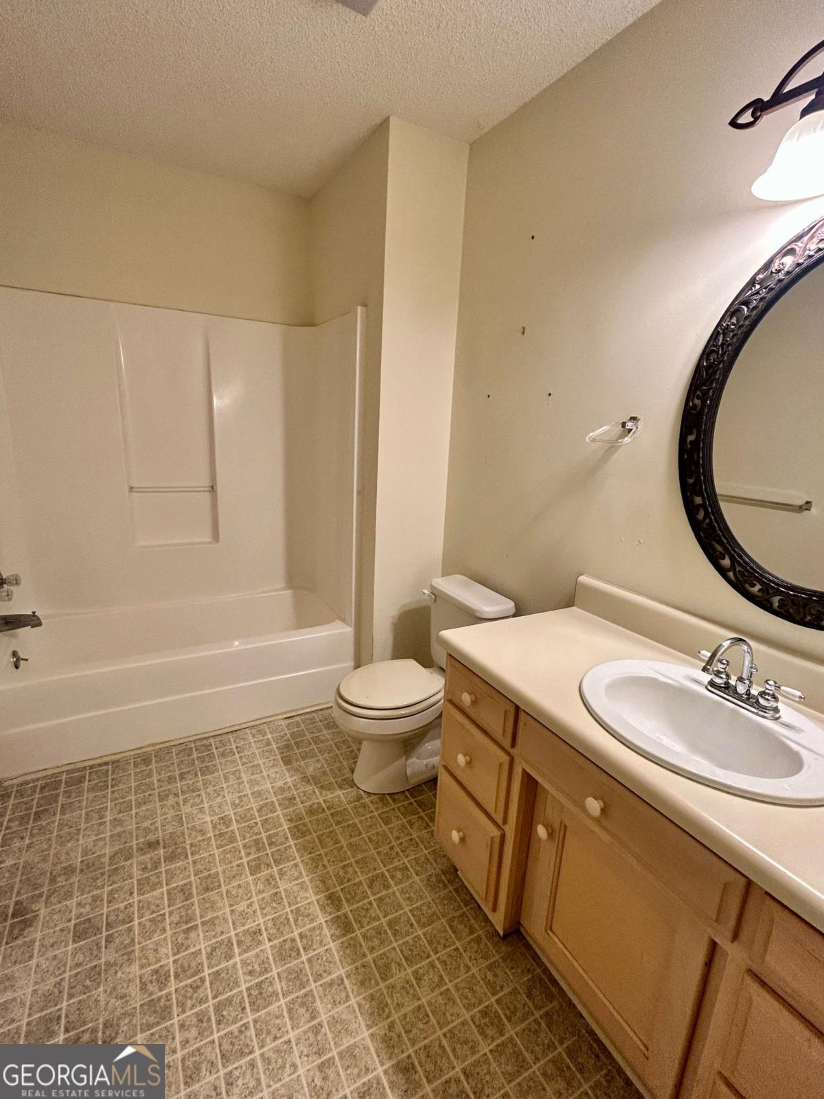 39 Paradise Lake Road Tifton, GA 31794 - Photo 15 of 23 a bathroom with a sink a toilet and a mirror