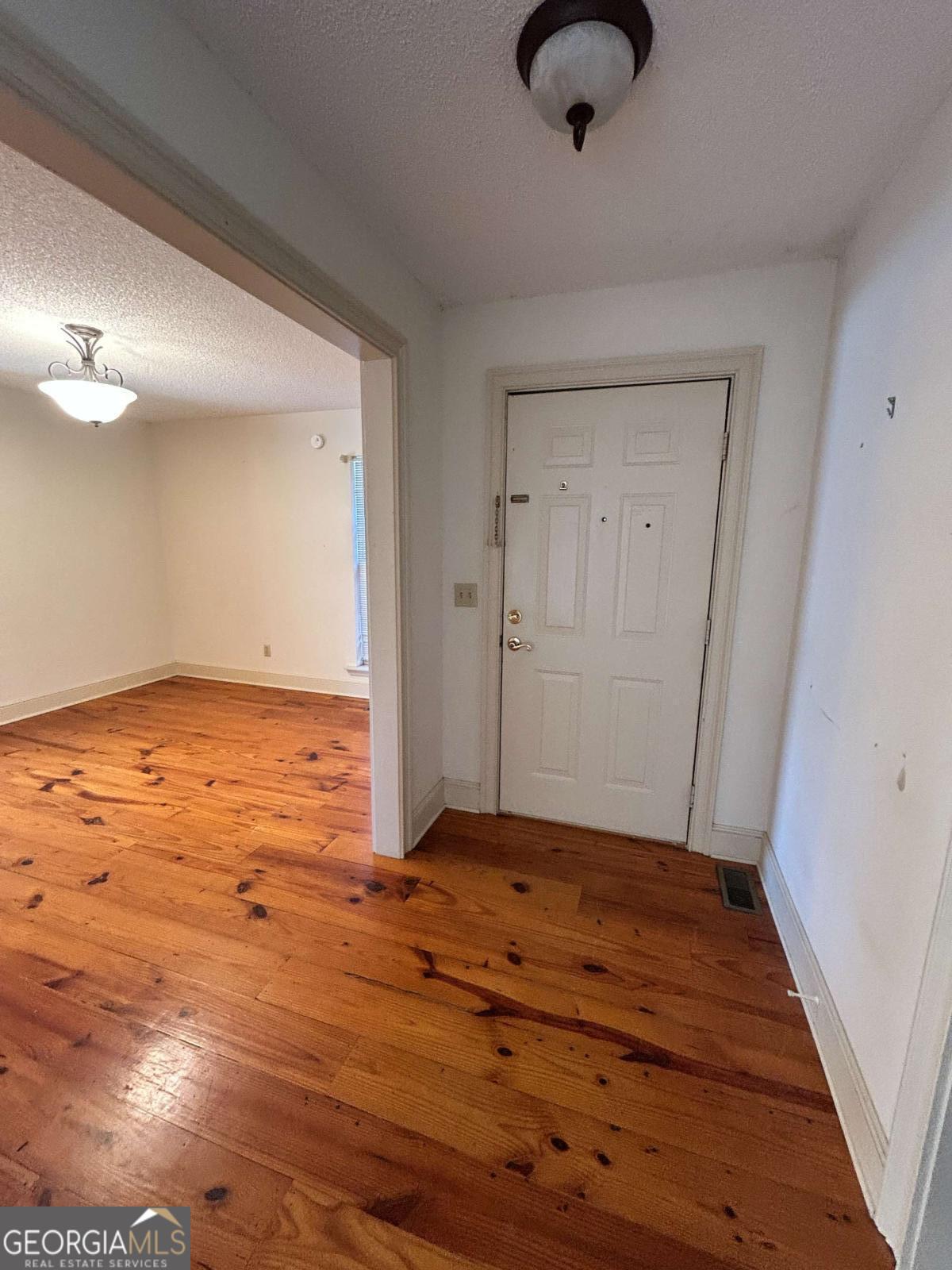 39 Paradise Lake Road Tifton, GA 31794 - Photo 2 of 23 a view of an empty room and wooden floor