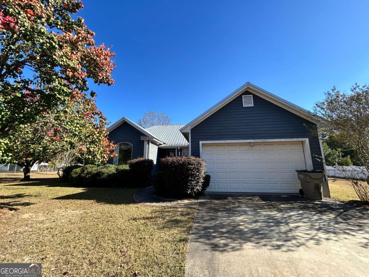 39 Paradise Lake Road Tifton, GA 31794 - Photo 23 of 23 a front view of a house with a yard