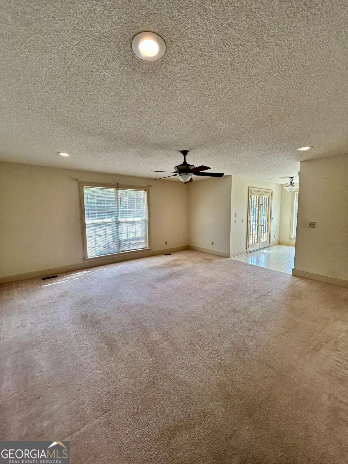 39 Paradise Lake Road Tifton, GA 31794 - Photo 9 of 23 an empty room with a empty space and windows