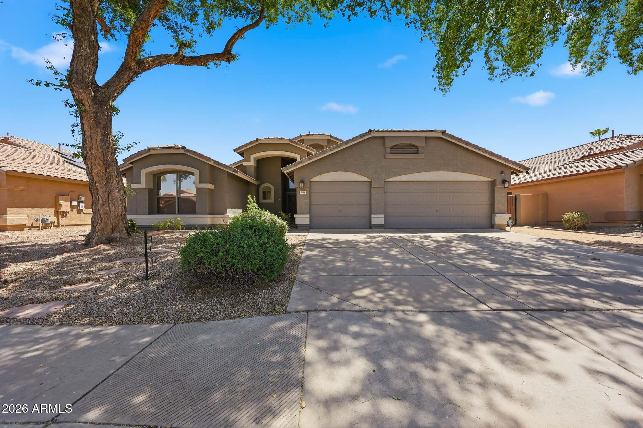 2153 East Kempton Road Chandler, AZ 85225 - Photo 28 of 50 a front view of a house with a yard
