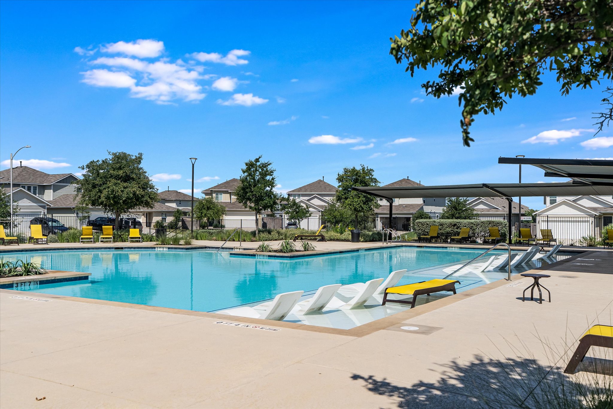 10317 Laurie Lane Austin, TX 78747 - Photo 24 of 27 Resort-style neighborhood pool just moments from home — perfect for cooling off on hot Texas afternoons, soaking up the sun, or enjoying weekends with friends and family.