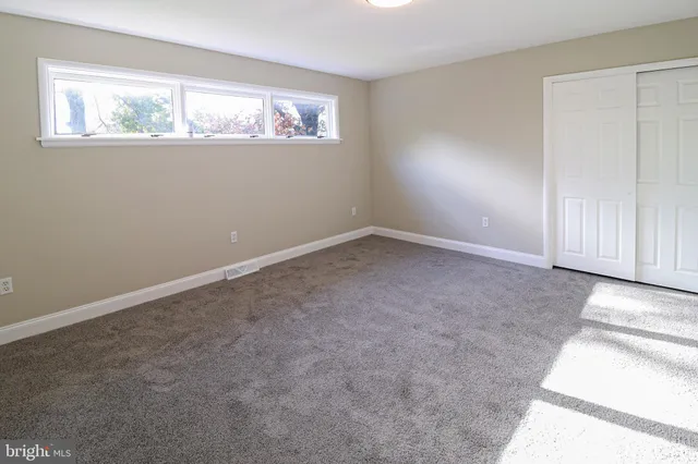 a bathroom with a shower and toilet