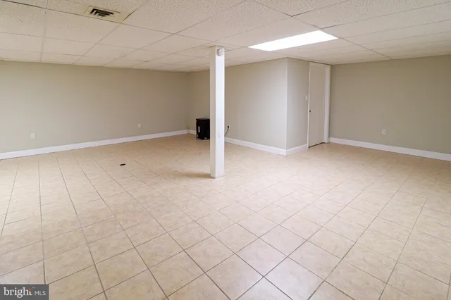 an empty room with white walls