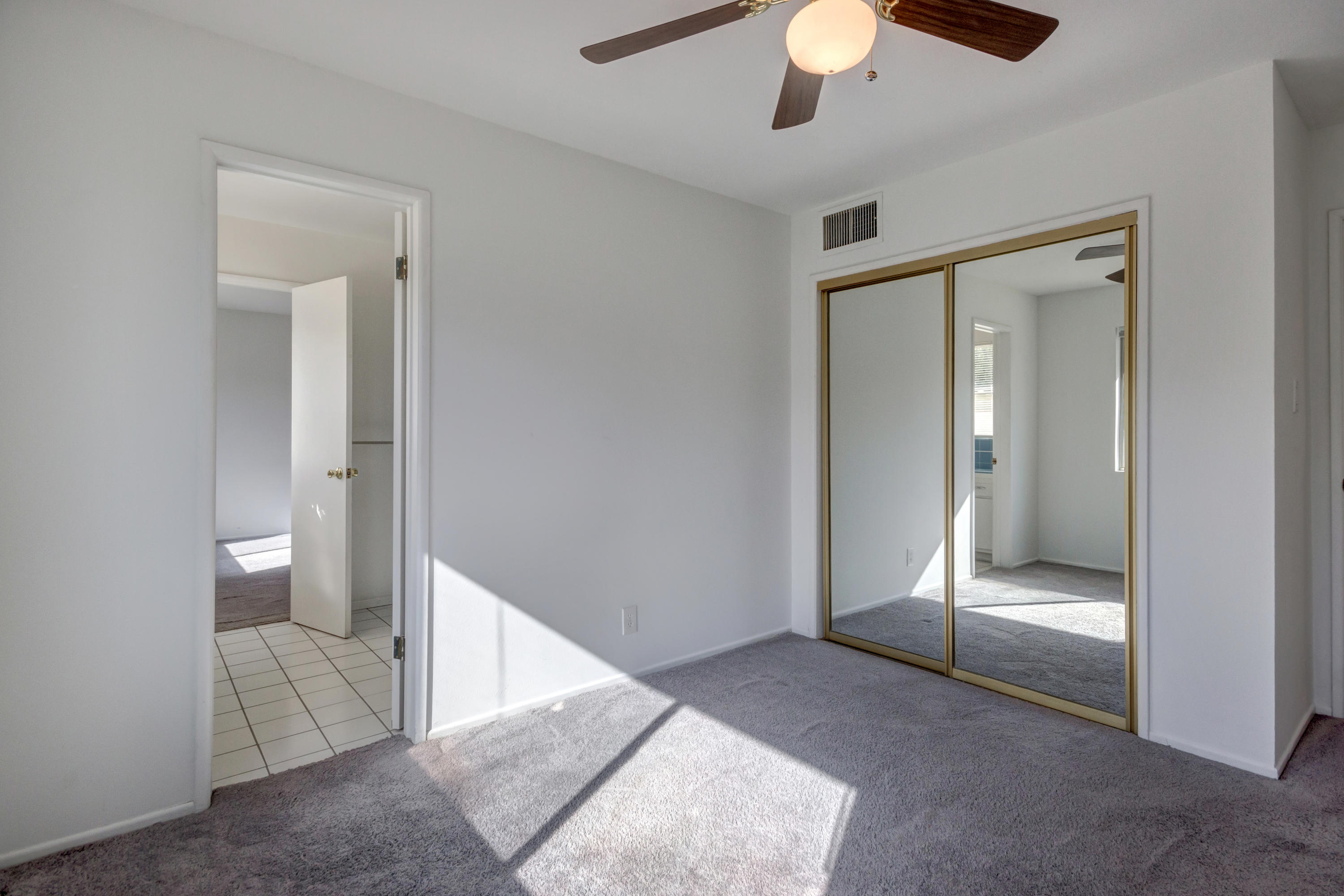 1253 Linda Vista Road Palm Springs, CA 92262 - Photo 20 of 29 a view of an empty room and chandelier fan