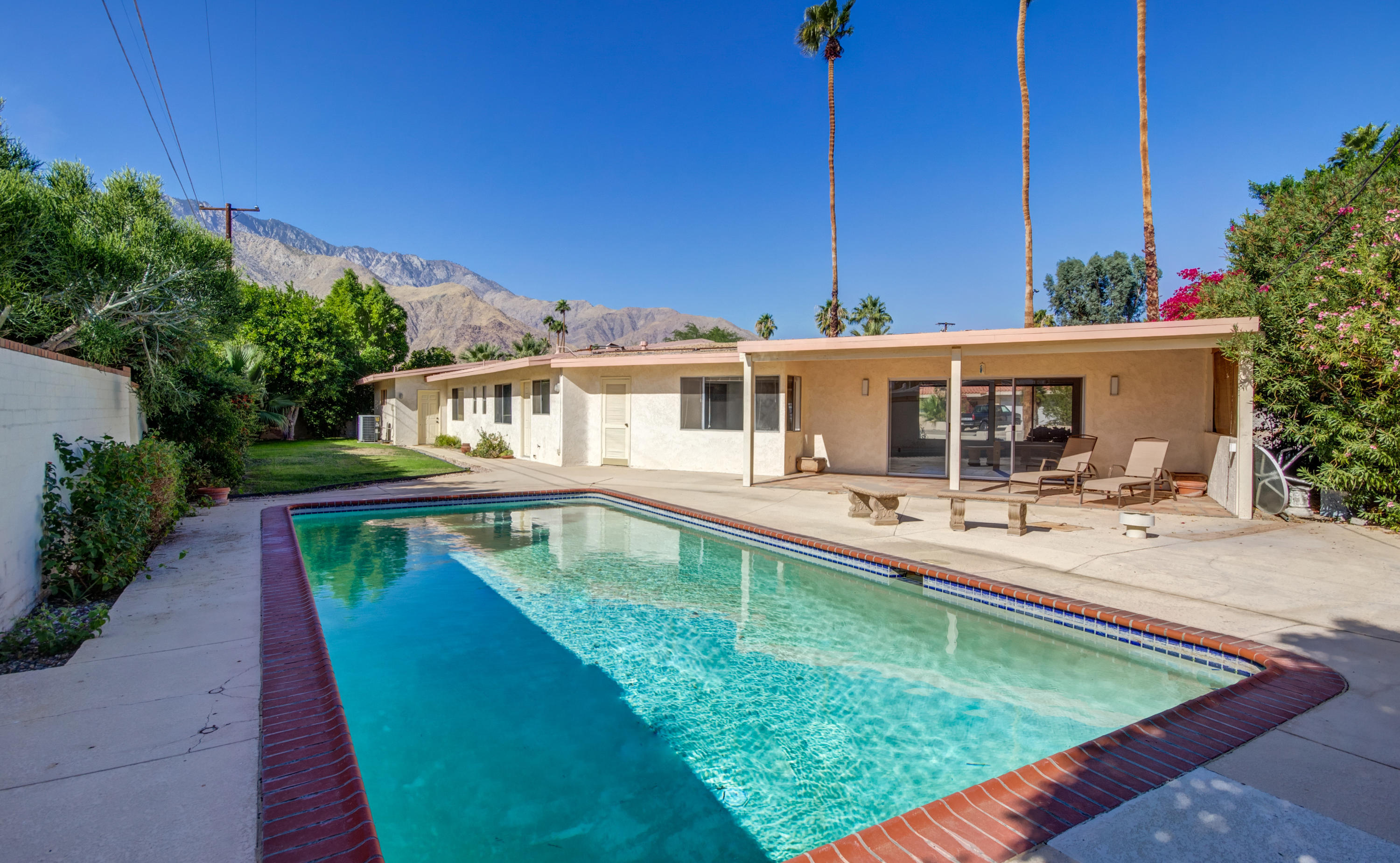 1253 Linda Vista Road Palm Springs, CA 92262 - Photo 26 of 29 a view of a house with swimming pool
