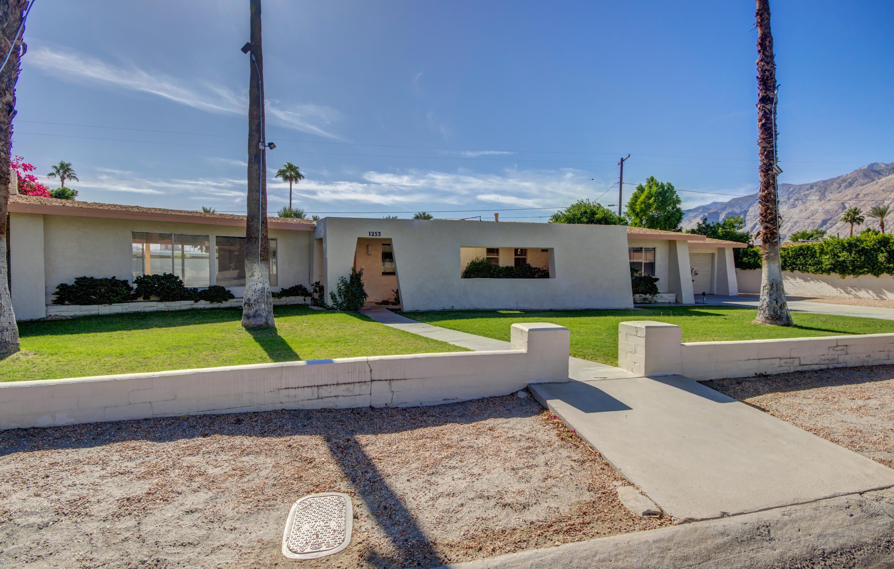 1253 Linda Vista Road Palm Springs, CA 92262 - Photo 4 of 29 a view of a swimming pool with a yard