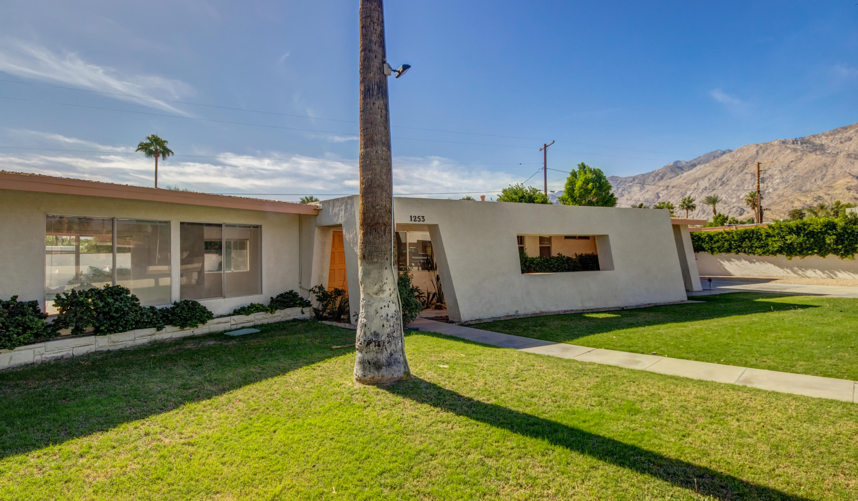 1253 Linda Vista Road Palm Springs, CA 92262 - Photo 5 of 29 a front view of a house with garden