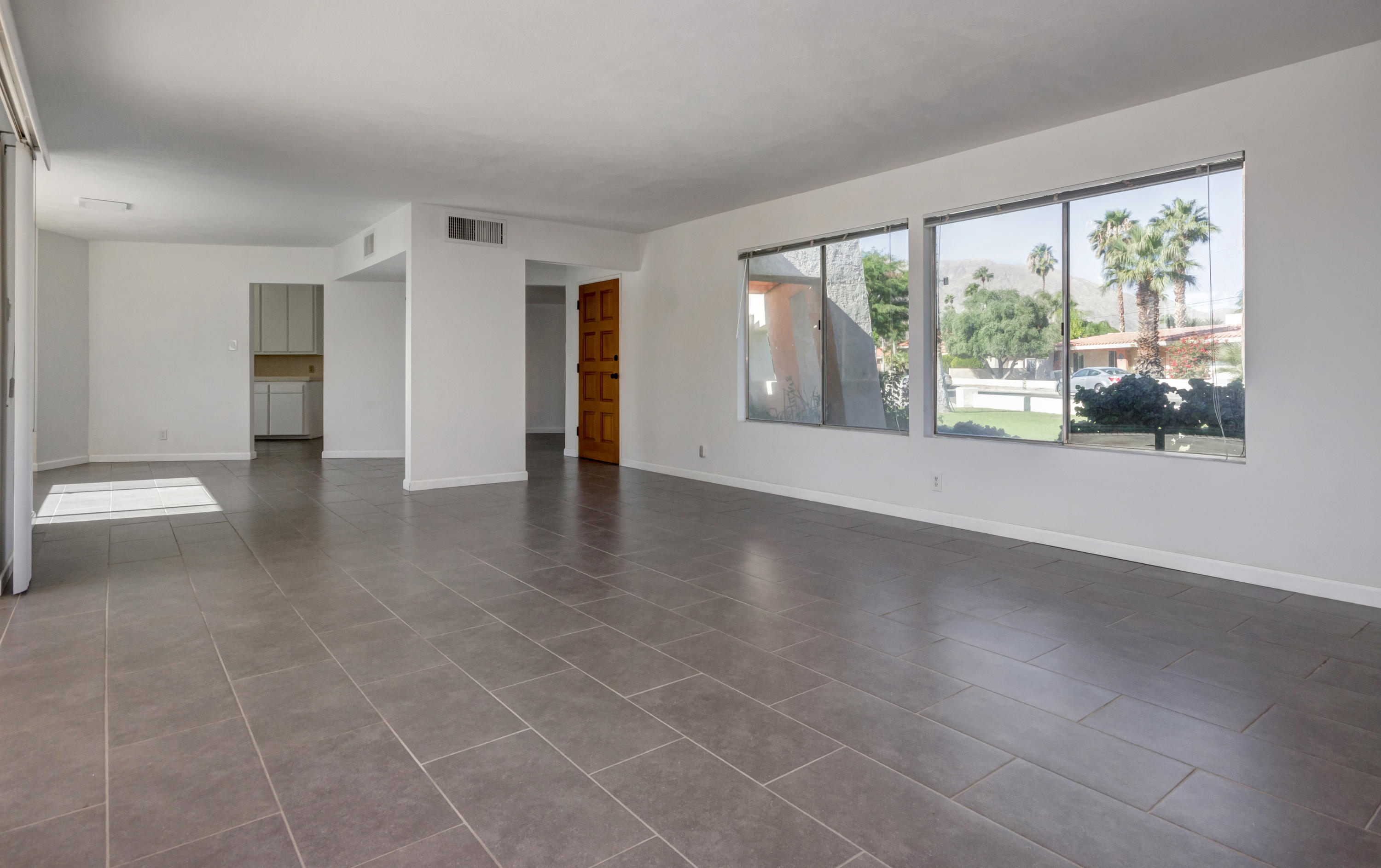 1253 Linda Vista Road Palm Springs, CA 92262 - Photo 10 of 29 an empty room with large windows