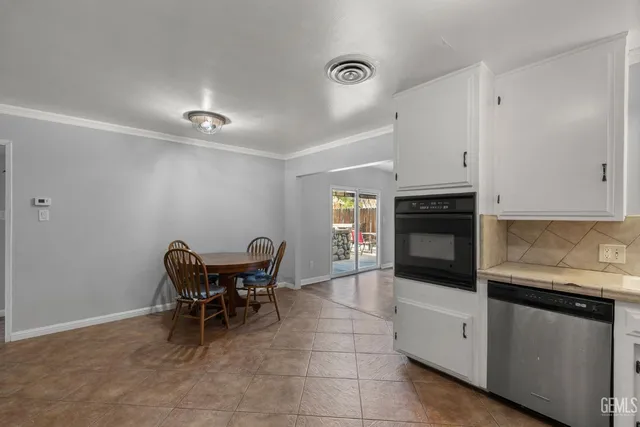 a view with a dining table and chairs