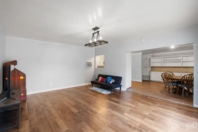 a view of a hallway with a room