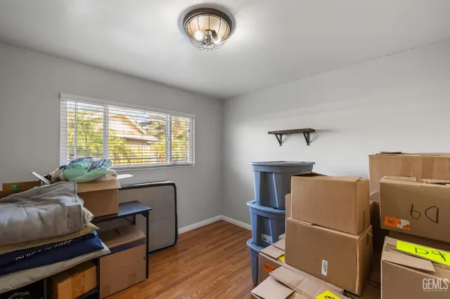 a bedroom with a bed and cabinets