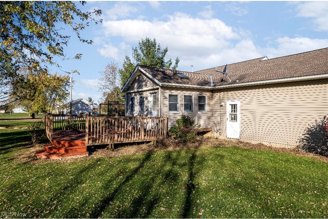 9066 Crow Road Litchfield, OH 44253 - Photo 7 of 28 View of yard with a wooden deck