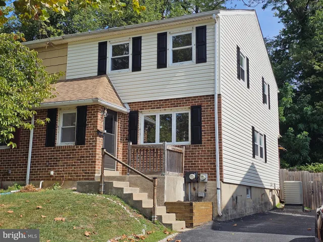 a front view of a house with garage