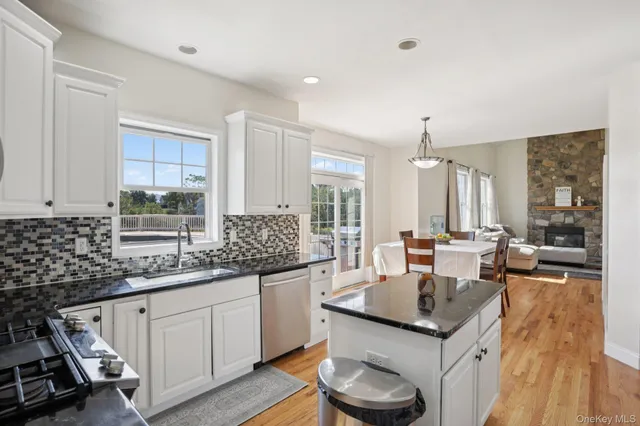 a backyard of a house with table and chairs