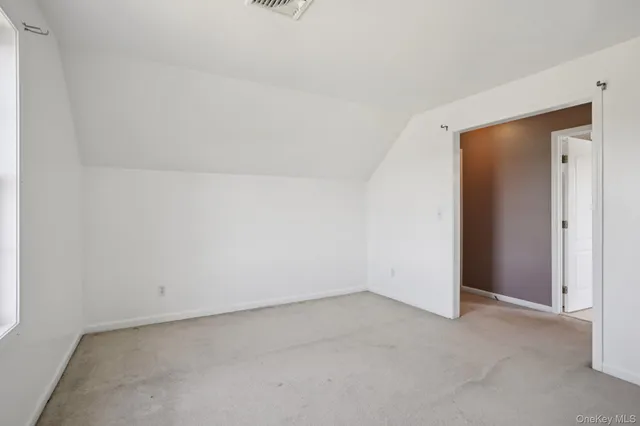 a bedroom with a bed and dresser